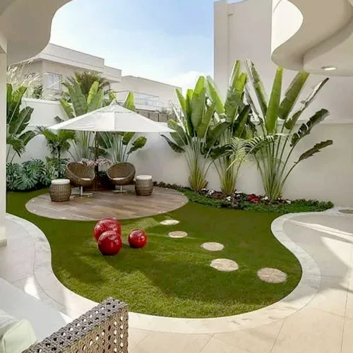 Aerial view of sports complex with artificial turf fields and parking lot